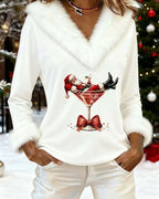 Womens Christmas sweater in White, front view by a Christmas tree