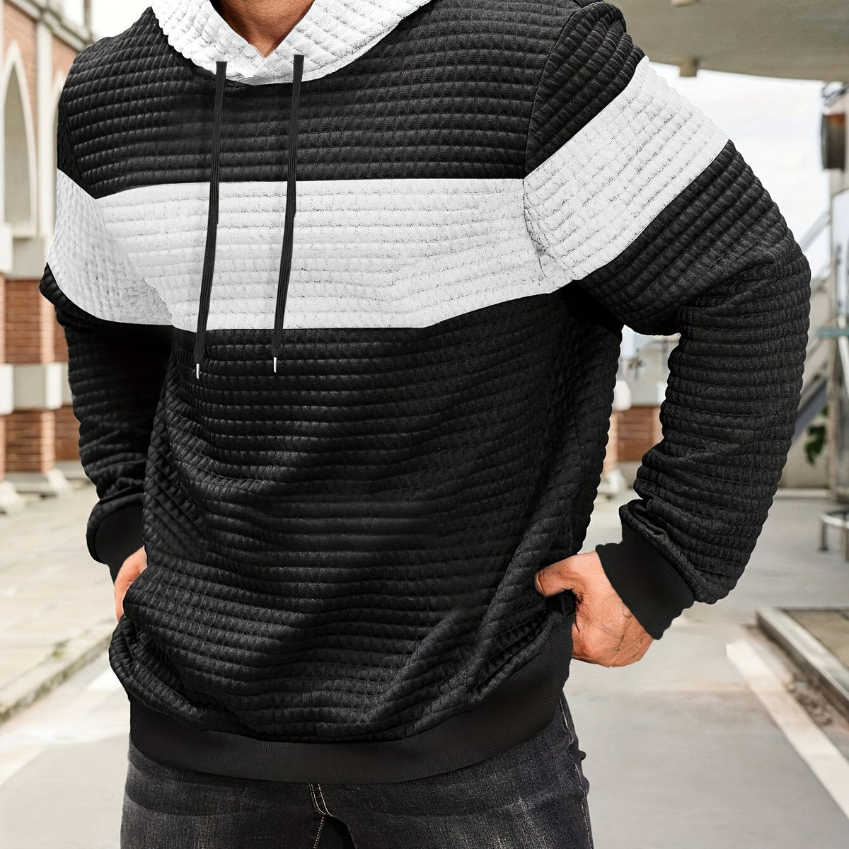 Mens hoodie in White with black body and white chest stripe, worn