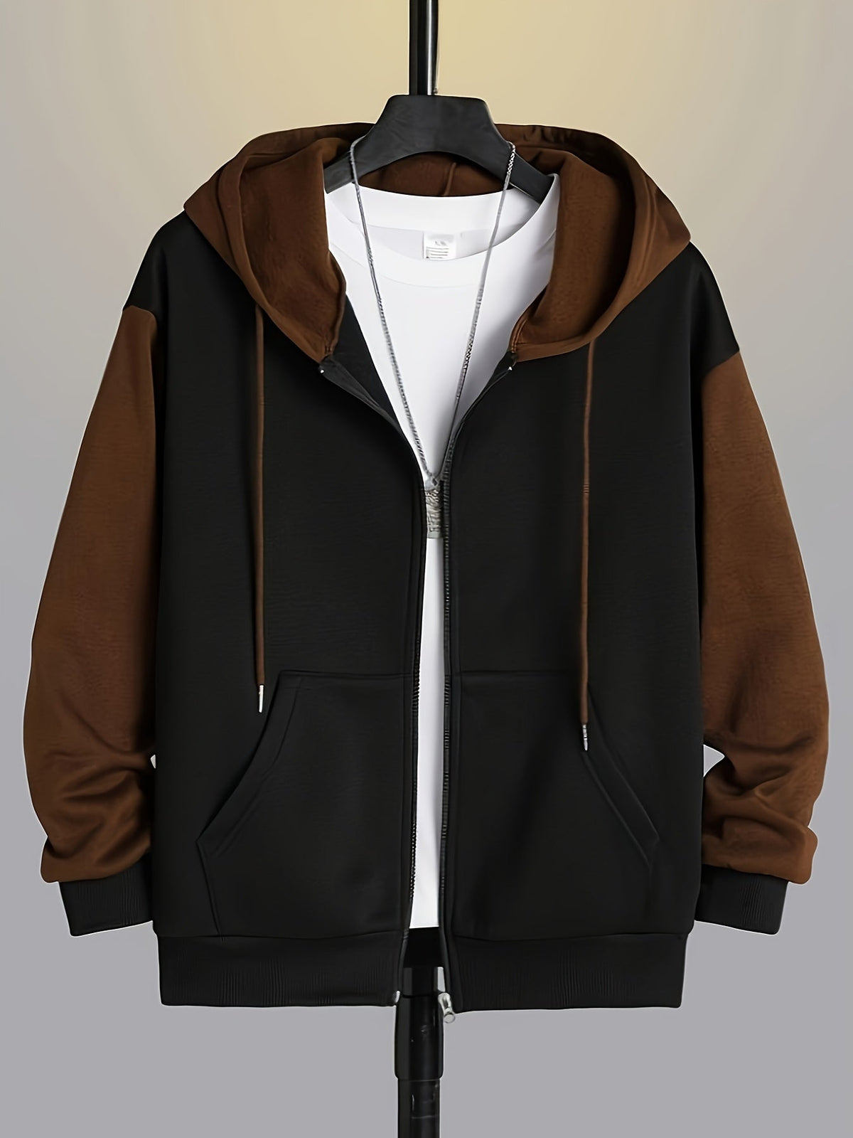 Mens zip up hoodie in Brown with black body, front view on a hanger