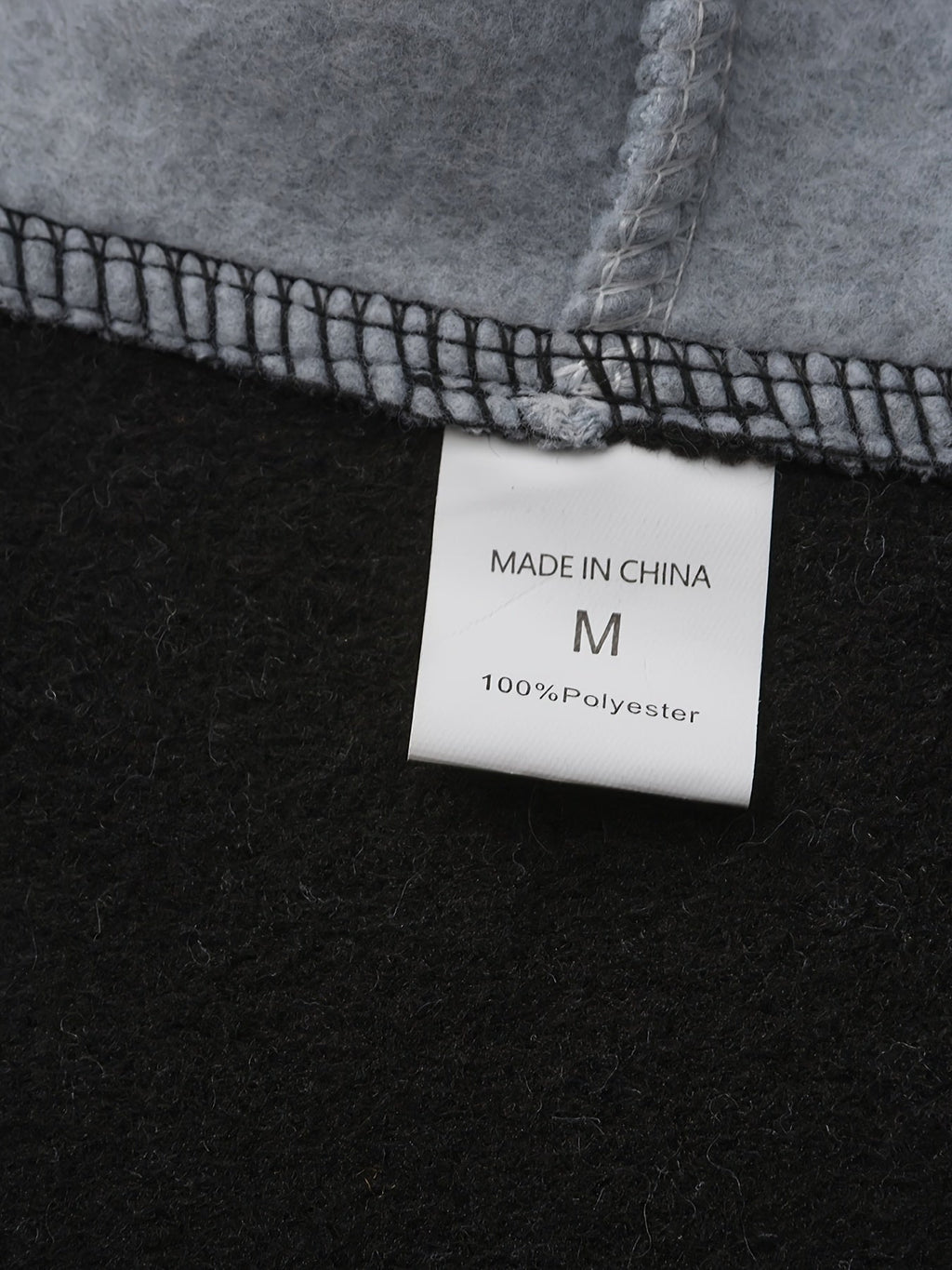 Mens zip up hoodie, care label inside the black fleece body