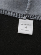 Mens zip up hoodie, care label inside the black fleece body