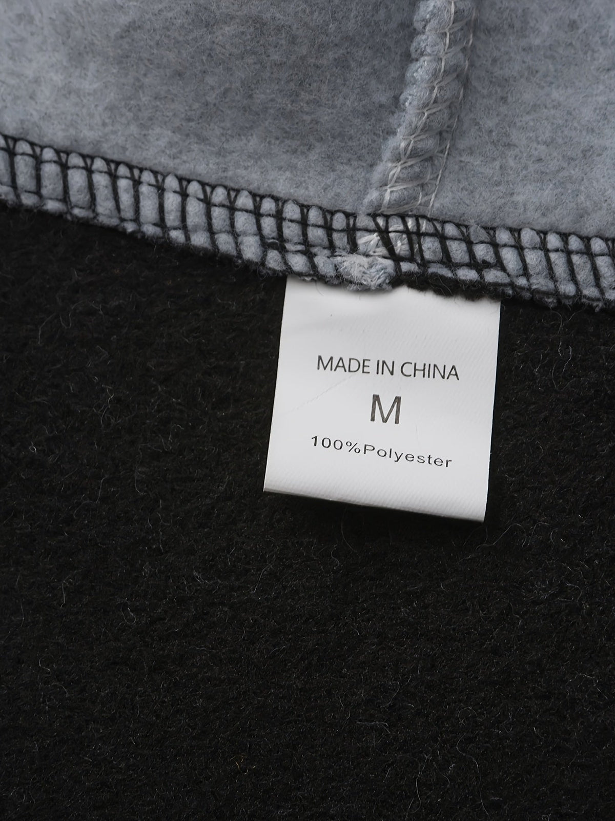 Mens zip up hoodie, care label inside the black fleece body