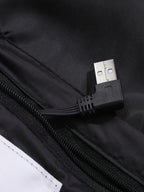 Mens heated jacket in Black, close-up of the USB lead in the inner pocket