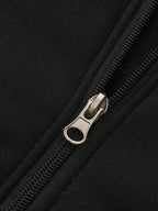 Mens zip up hoodie, close-up of the zip on the black body