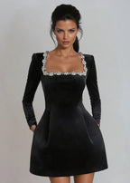 Womens velvet mini dress in Black, close view of the rhinestone square neckline