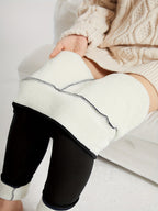 Womens fleece lined leggings in Black, lining shown at the leg