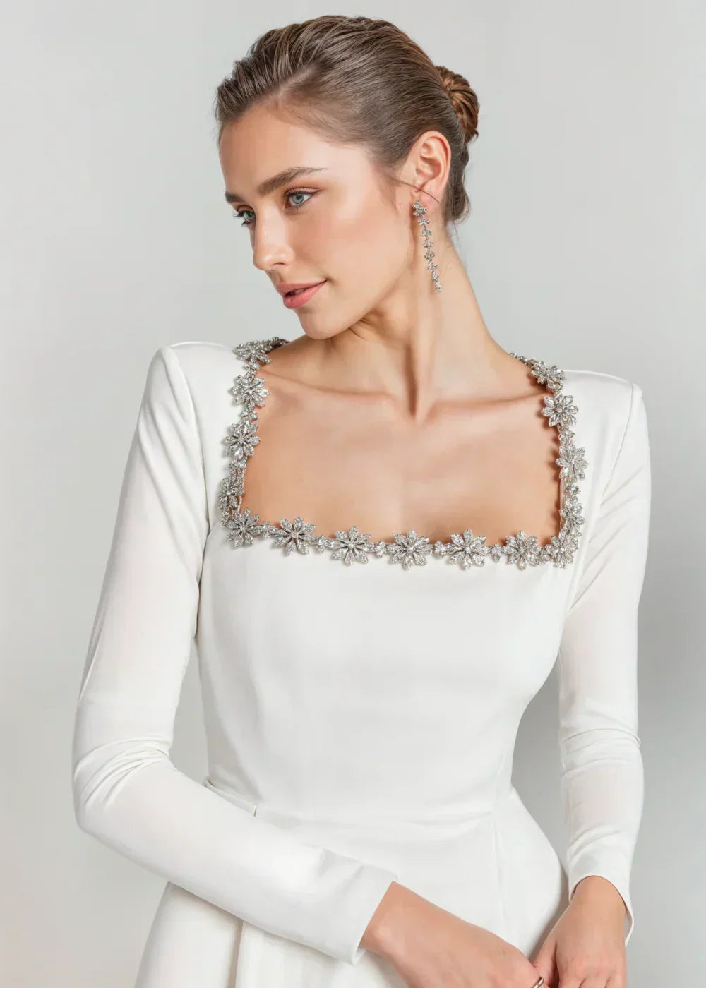 Womens velvet mini dress in White, close view of the rhinestone neckline