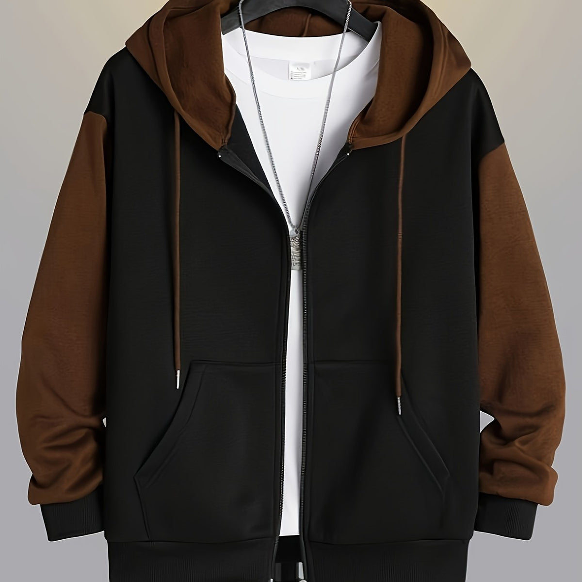 Mens zip up hoodie in Brown with black body, worn open over a white tee