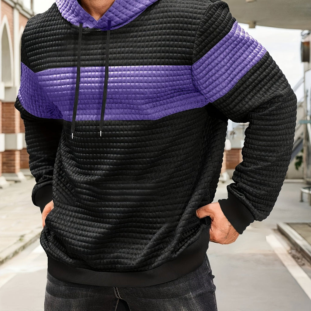 Mens hoodie in Purple with black body and purple chest stripe, worn