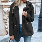 Womens teddy coat in Black, double-breasted with notched lapels, worn over jeans
