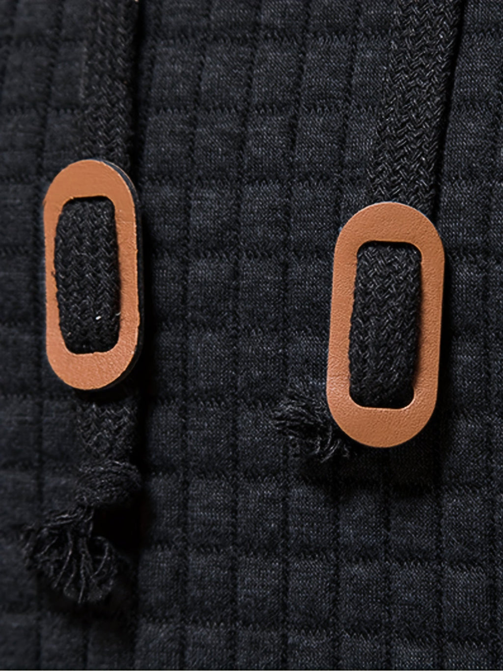 Mens waffle knit hoodie in Black, close-up of the cord tabs