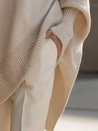 Womens oversized sweater in Beige, close view of the side slit and cuff