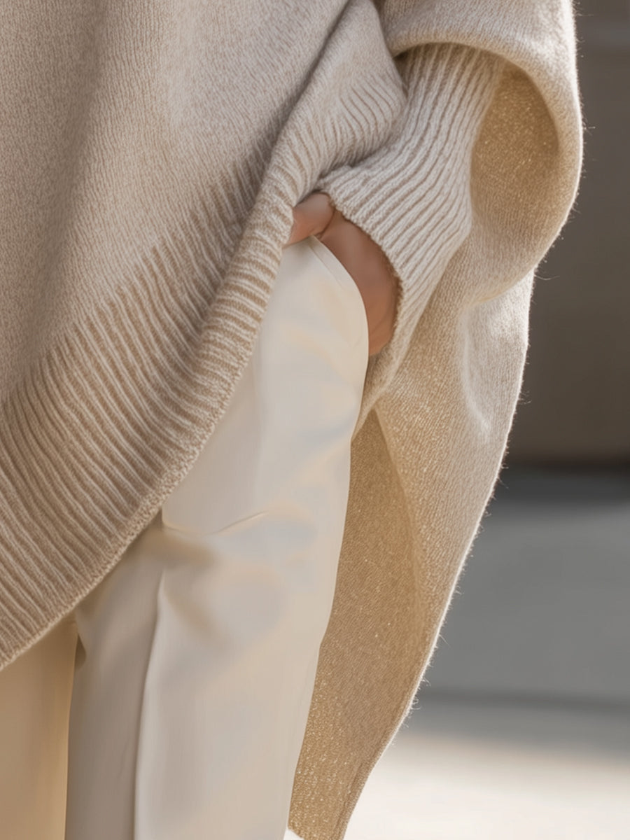 Womens oversized sweater in Beige, close view of the side slit and cuff