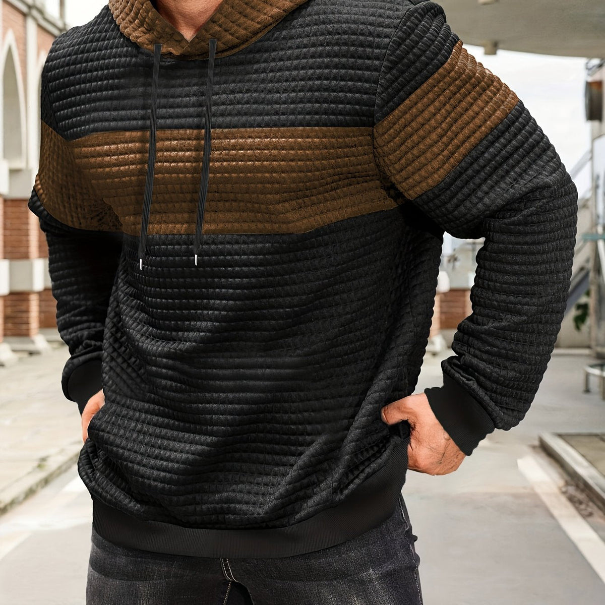 Mens hoodie in Brown with black body and brown chest stripe, worn