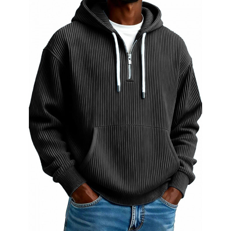 Mens quarter zip hoodie in Black, front view worn with jeans