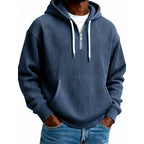 Mens quarter zip hoodie in Navy, front view worn with jeans