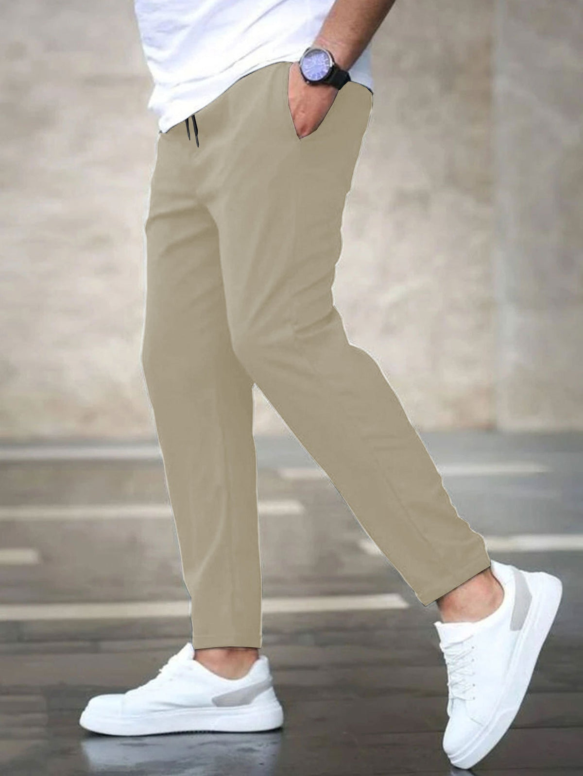 Mens casual pants in Cream, tapered leg with drawstring waist, worn with white sneakers