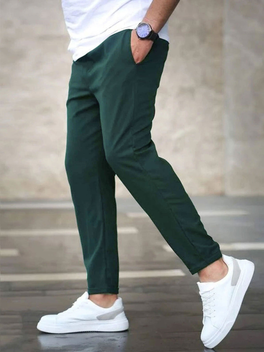 Mens casual pants in Green, tapered leg with drawstring waist, worn with white sneakers
