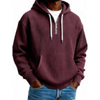 Mens quarter zip hoodie in Burgundy, front view worn with jeans