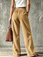 Womens wide leg corduroy pants in Khaki, back view with elastic waist