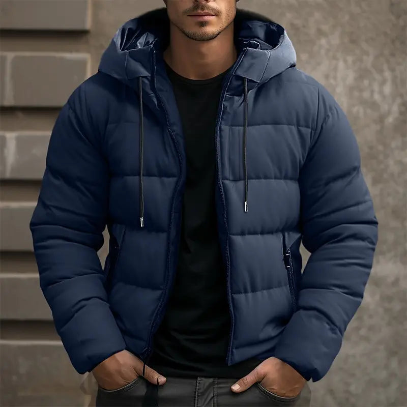 Mens puffer jacket in Navy with drawstring hood, worn over a black tee