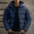 Mens puffer jacket in Navy with drawstring hood, worn over a black tee
