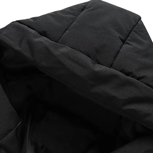 Puffer jacket in Black, close-up of the quilted hood