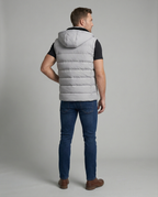 Mens puffer vest with hood in Gray, back view with hood up behind