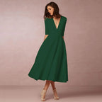 Womens A line midi dress with deep V neck in Green, front view