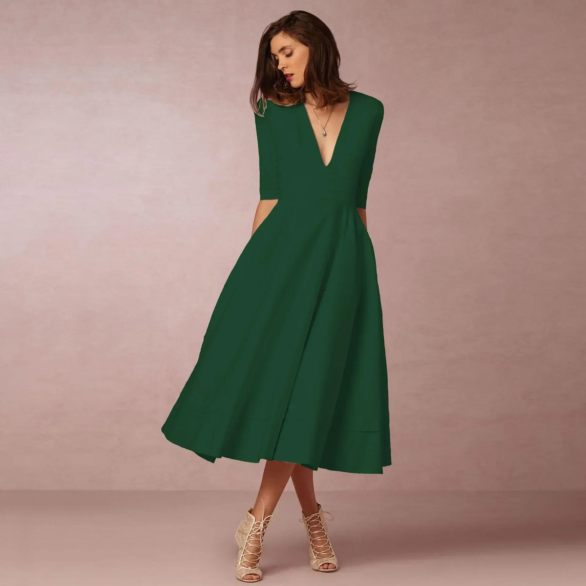 Womens A line midi dress with deep V neck in Green, front view