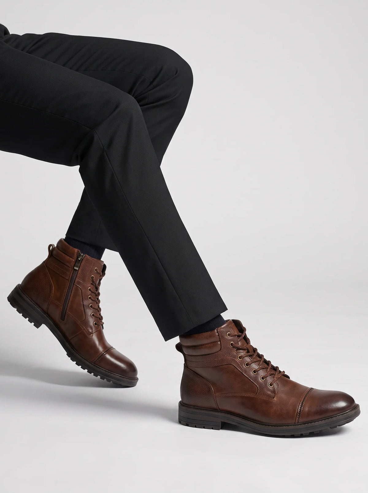 Mens work boots in Brown, worn, pair in motion