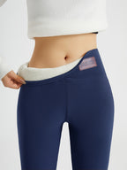 Womens fleece lined leggings in Navy, high waist folded to show the plush lining