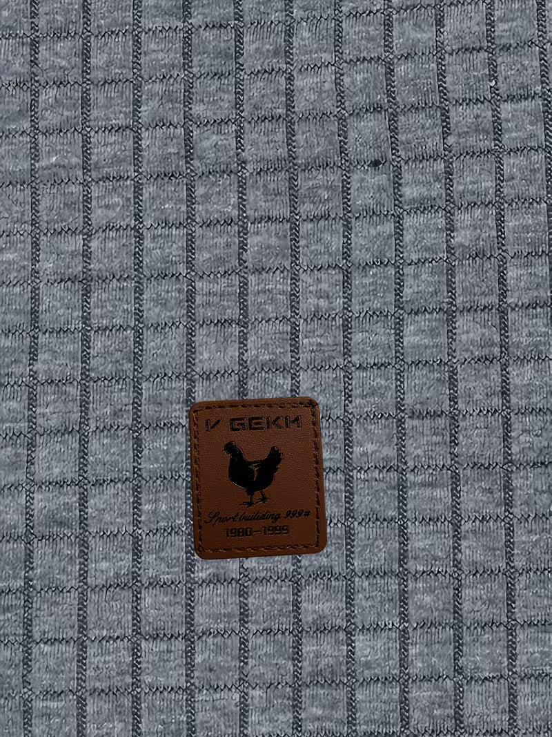 Mens waffle knit hoodie in Charcoal, close-up of the waffle texture and patch