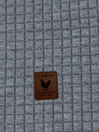 Mens waffle knit hoodie in Charcoal, close-up of the waffle texture and patch