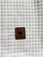 Mens waffle knit hoodie in White, close-up of the waffle texture and patch