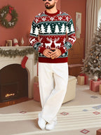 Mens Christmas sweater in Red, full-length view by a fireplace