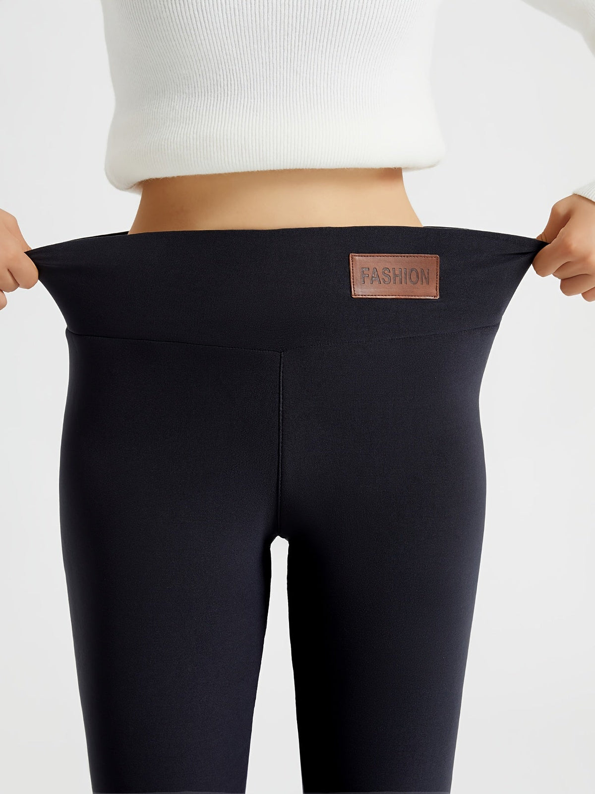 Womens fleece lined leggings in Black, waistband stretched