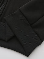 Mens zip up hoodie, close-up of the black ribbed cuff