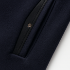 Mens overcoat in Navy, close-up of the trimmed pocket