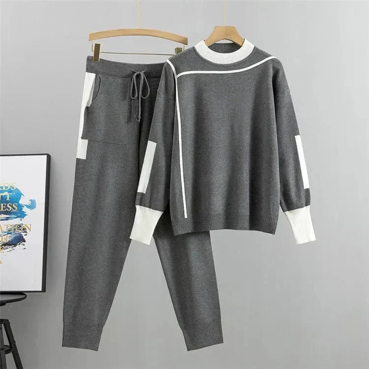 Womens tracksuit with contrast stripe trim in Gray, sweater and joggers on a hanger