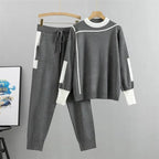 Womens tracksuit with contrast stripe trim in Gray, sweater and joggers on a hanger