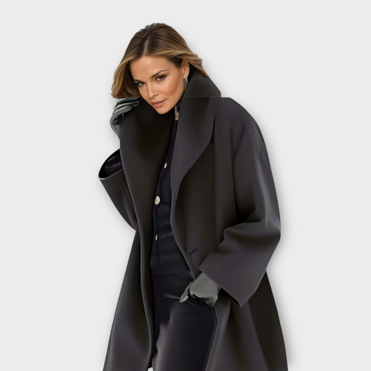 Womens wool coat with shawl collar in Black, swing cut, worn open over dark knitwear