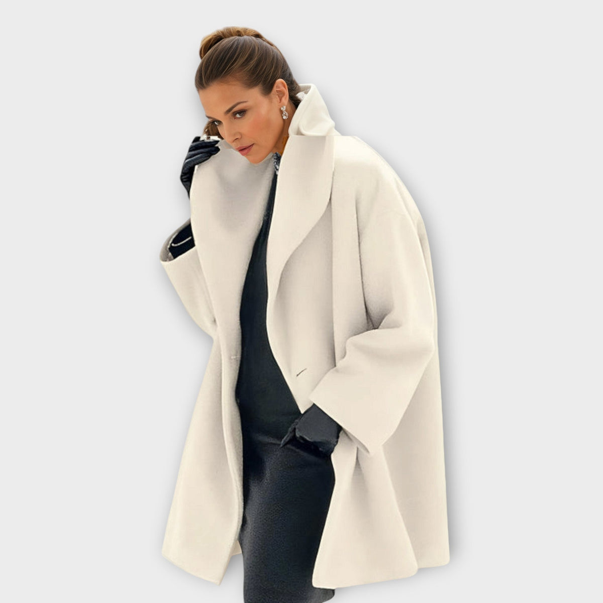 Womens wool coat with shawl collar in White, swing cut, worn open over dark knitwear