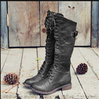 Womens knee high boots in Black with full lace up front and buckle strap