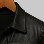 Mens leather trucker jacket in Black, close-up of the collar and shoulder seam