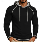 Mens pullover hoodie in Black with contrast stitching, worn