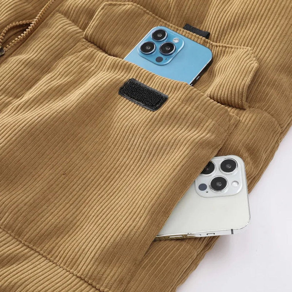 Corduroy puffer vest in Tan, close-up of the flap pocket and corduroy