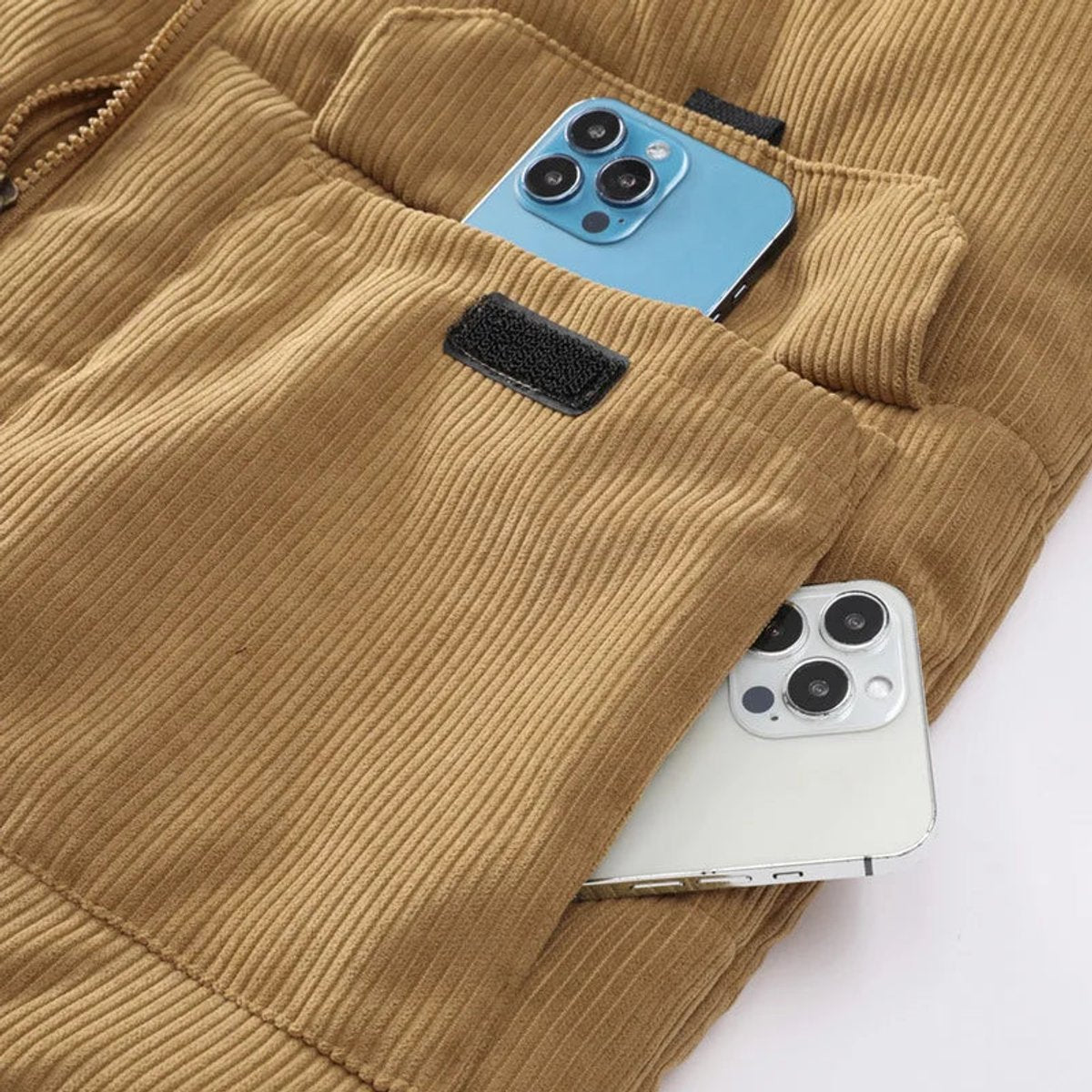 Corduroy puffer vest in Tan, close-up of the flap pocket and corduroy