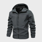 Mens softshell jacket in Gray with attached hood and sleeve zip pocket