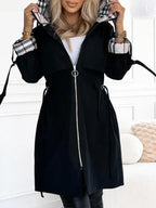 Womens waterproof jacket in Black with plaid hood lining and cuffs